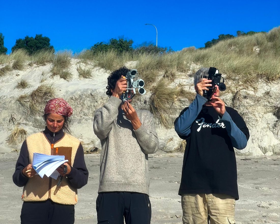 Three Dog Star students sighting with sextants against the dunes at Ocean Beach