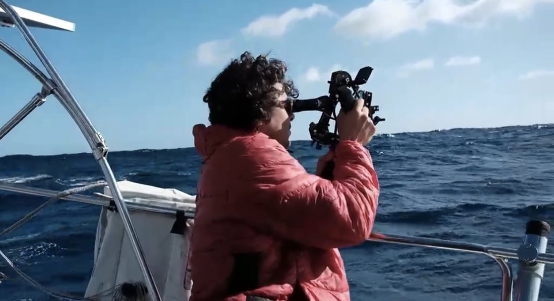 A Dog Star student taking a sextant sight at sea